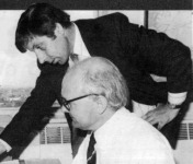 Passenger planning and timetable officer John Batchelor (standing) studies the APT path on a section of the West Coast main line timing graph with timing assistant John Hughes.